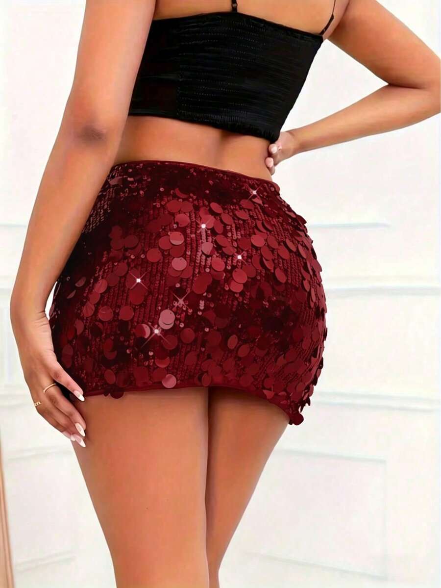 Women's high waist black sequin bodycon mini skirt featuring sparkling embellishments, unlined polyester fabric, ideal for night out and party wear.