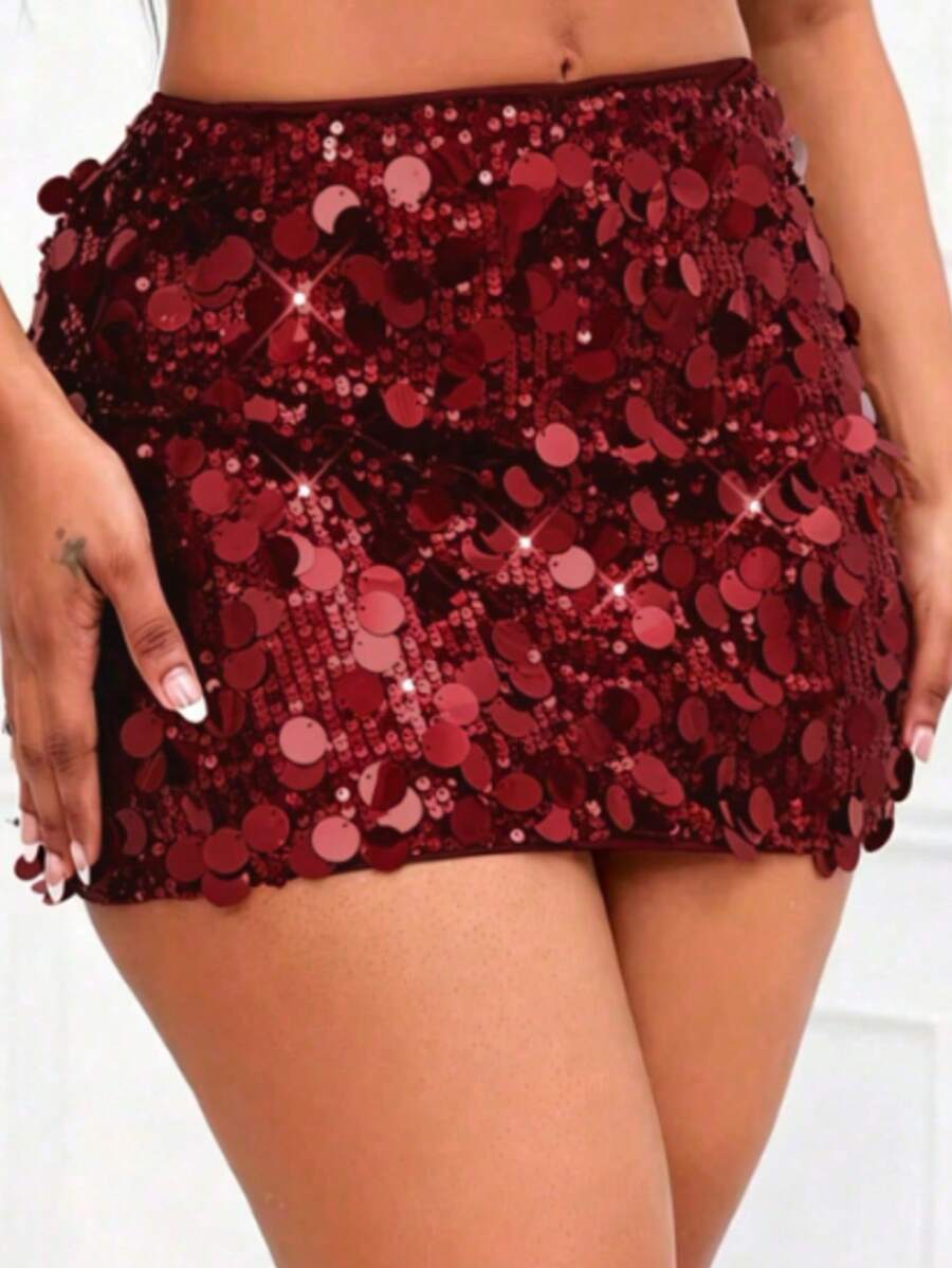 Women's high waist black sequin bodycon mini skirt featuring sparkling embellishments, unlined polyester fabric, ideal for night out and party wear.