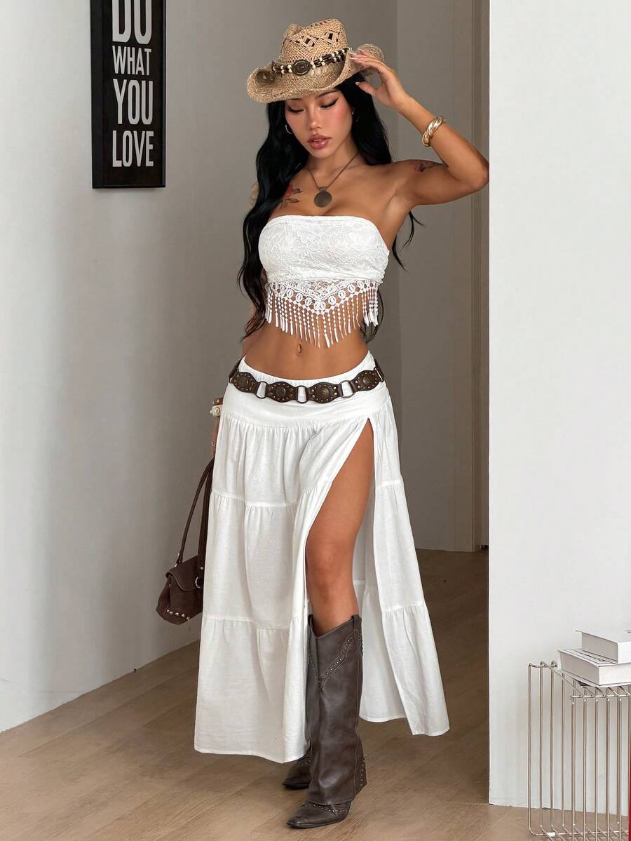 Women's black low waist split thigh long skirt featuring semi-sheer textured fabric and a flared skinny fit.