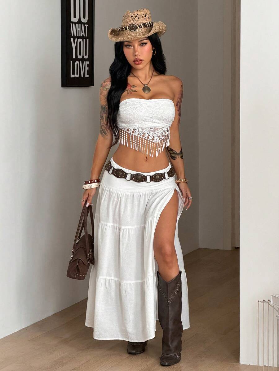 Women's black low waist split thigh long skirt featuring semi-sheer textured fabric and a flared skinny fit.