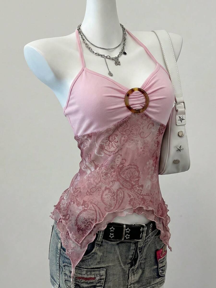 Women's backless halter cami top featuring a paisley print, sleeveless design, and an asymmetrical hem in knitted fabric.