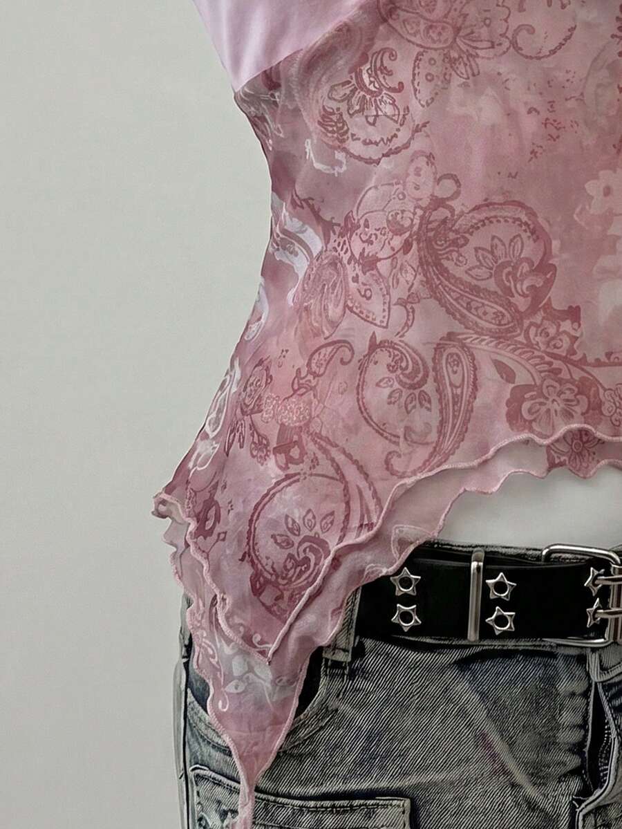 Women's backless halter cami top featuring a paisley print, sleeveless design, and an asymmetrical hem in knitted fabric.