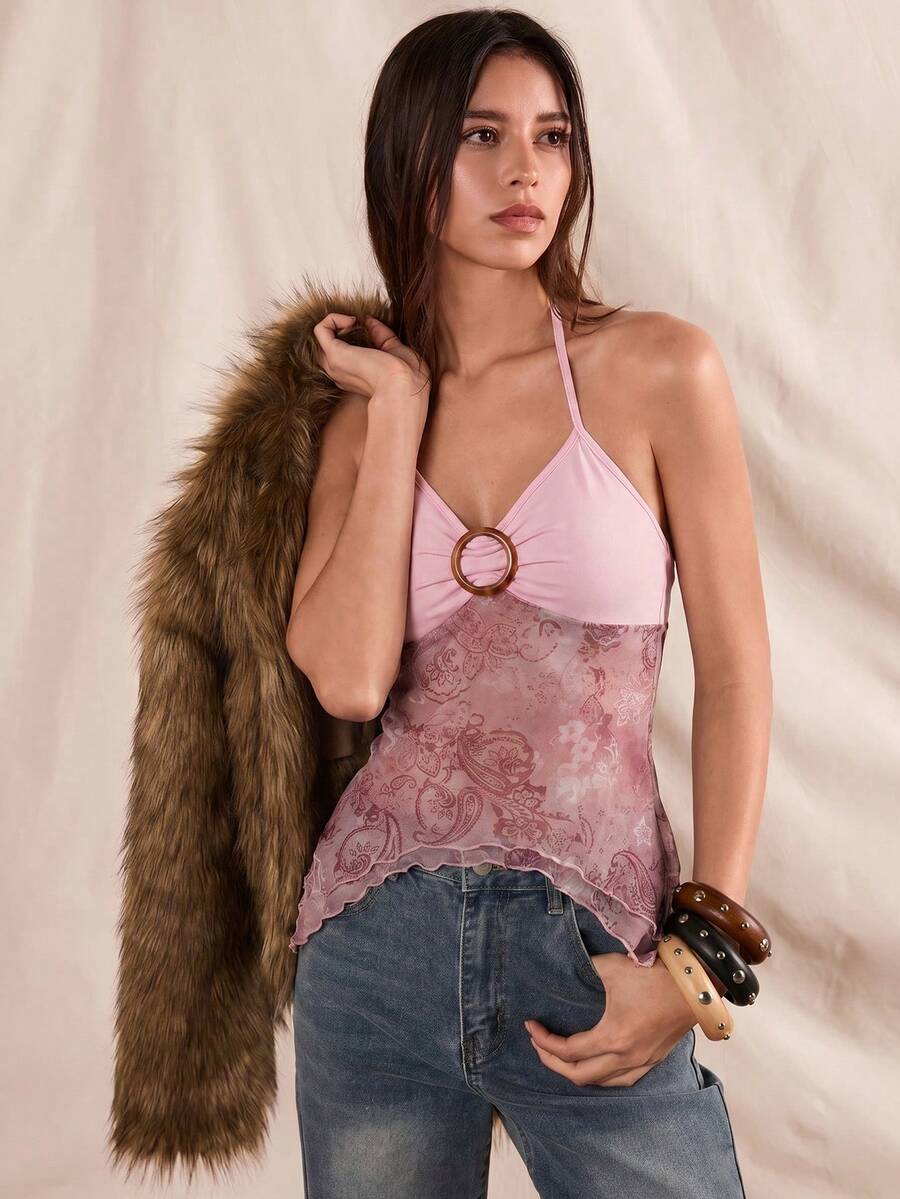 Women's backless halter cami top featuring a paisley print, sleeveless design, and an asymmetrical hem in knitted fabric.
