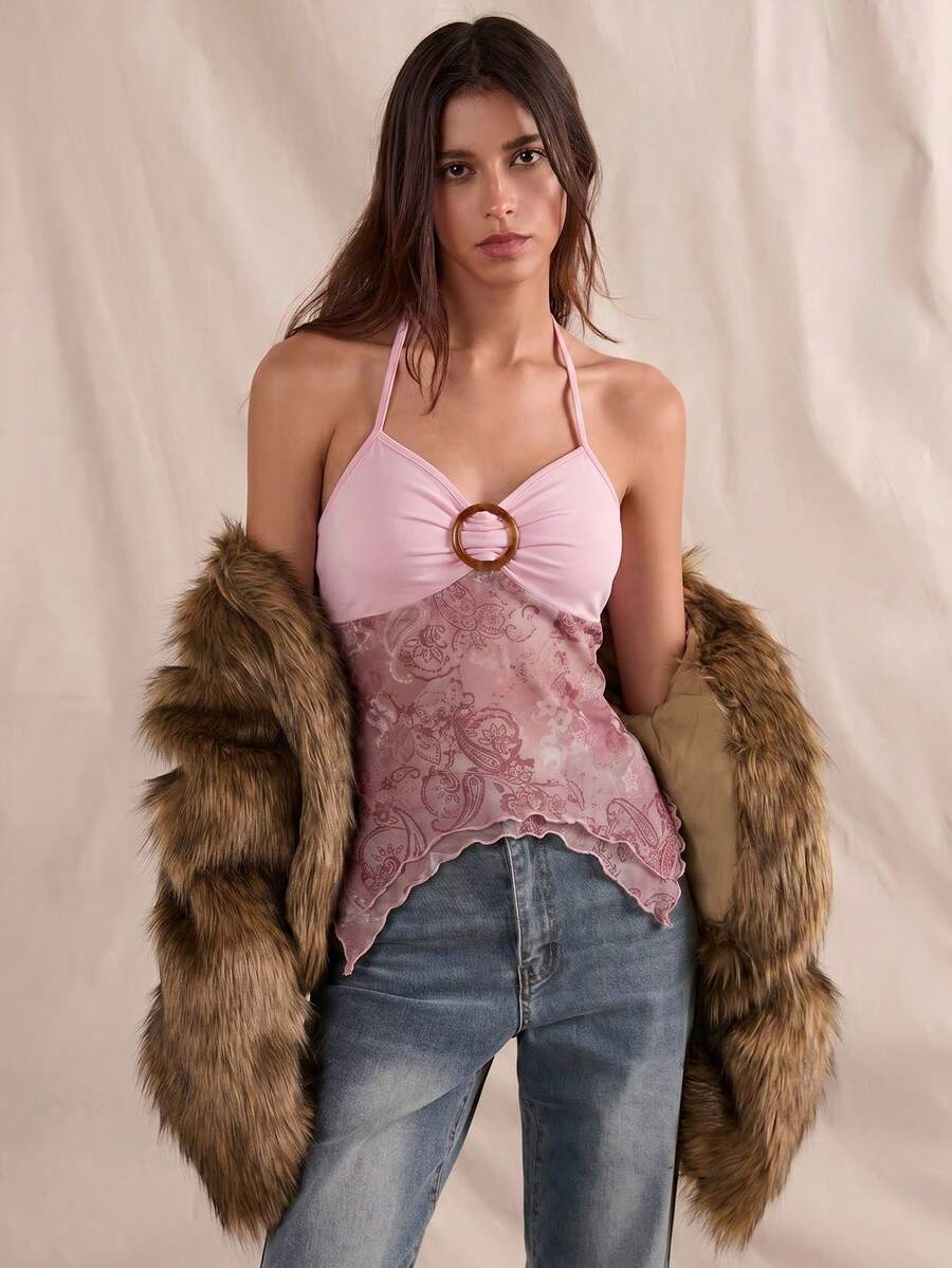 Women's backless halter cami top featuring a paisley print, sleeveless design, and an asymmetrical hem in knitted fabric.