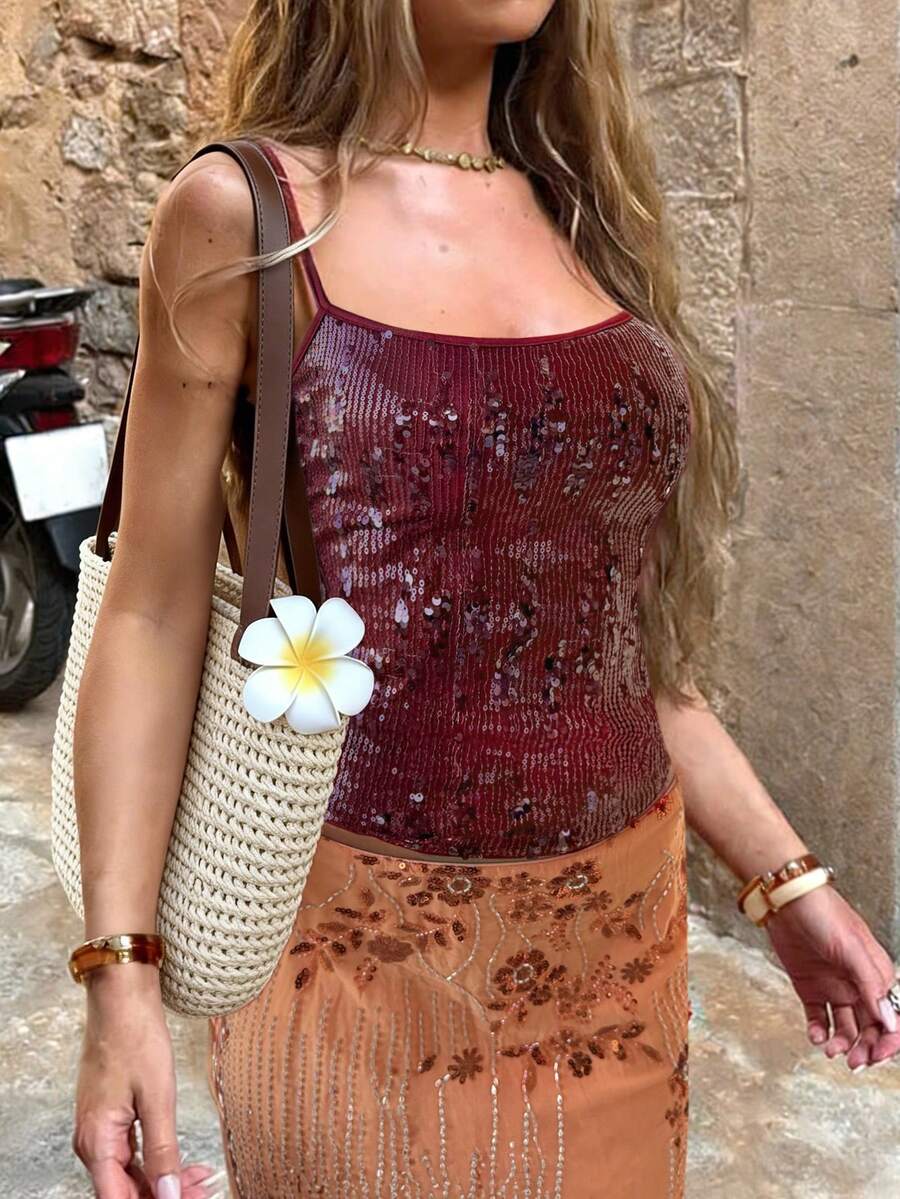 Women's burgundy glitter sequin cami tank top with thin spaghetti straps and a short length fit.