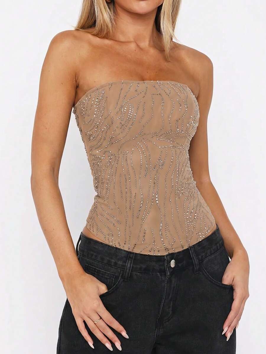 Black strapless corset tube top with sparkling rhinestone decor, boned silhouette, and lace-up tie back.