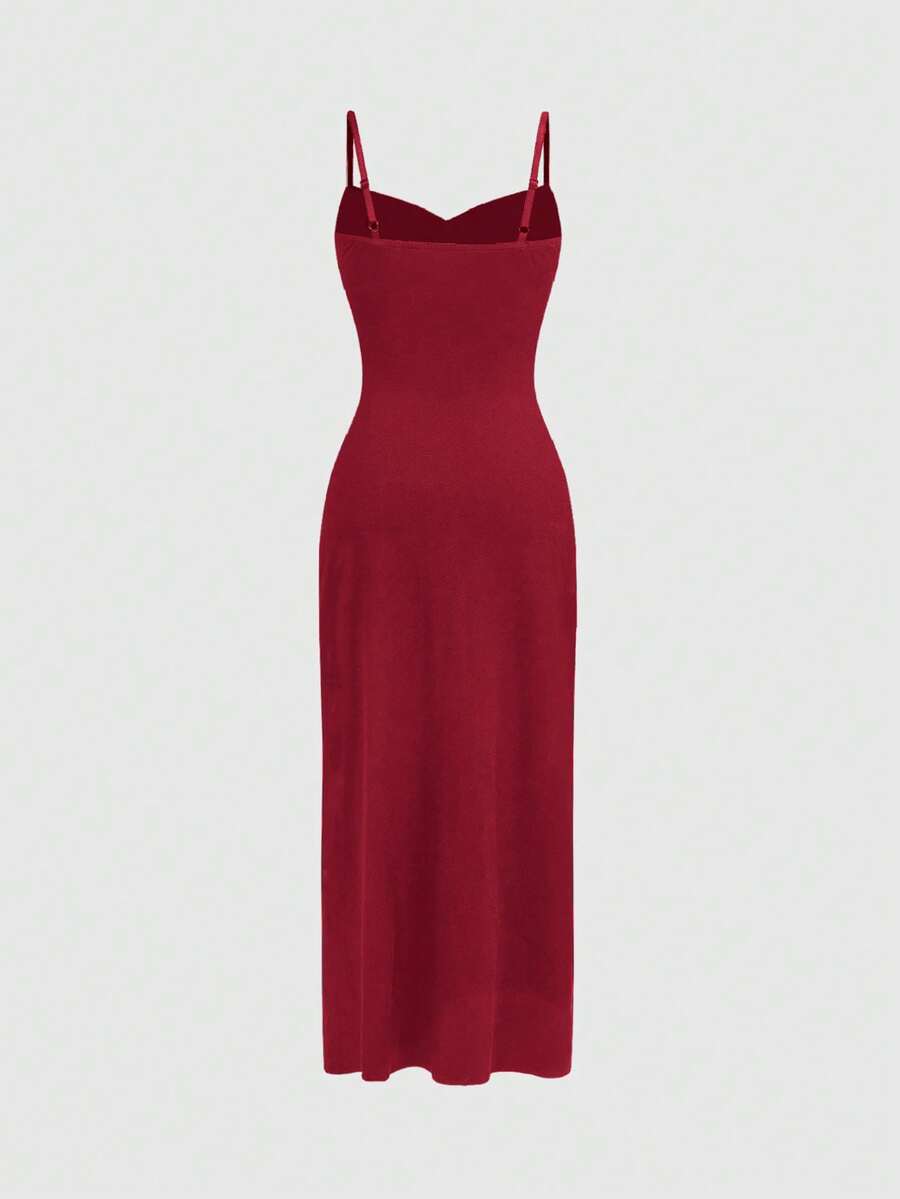 Black gothic bodycon slip dress featuring spaghetti straps, lace-up grommet eyelet accents, and a high split thigh hem.