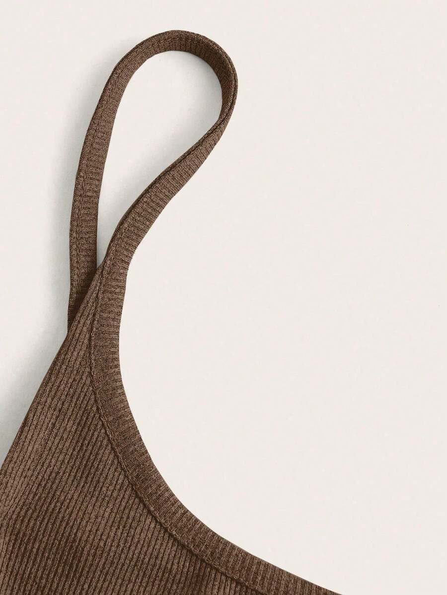 Women's black cropped camisole top with faux crocodile texture, backless spaghetti straps, and matching arm sleeves.