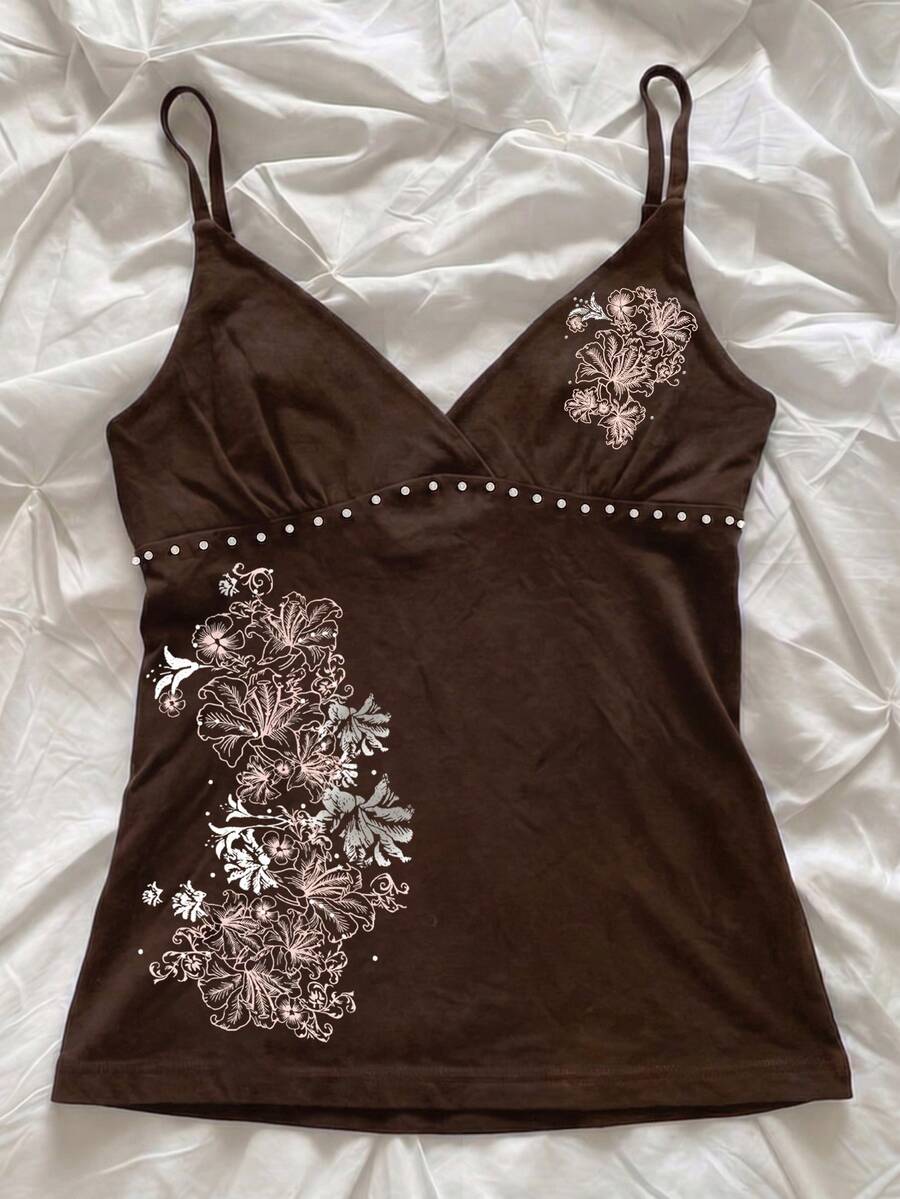 Women's slim fit spaghetti strap cami top featuring a tropical hibiscus floral graphic print.