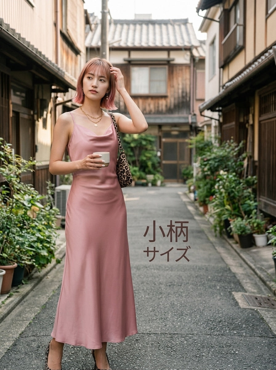 Women's long apricot satin cami dress featuring a draped swing collar, spaghetti straps, backless zipper back, and mermaid hem.