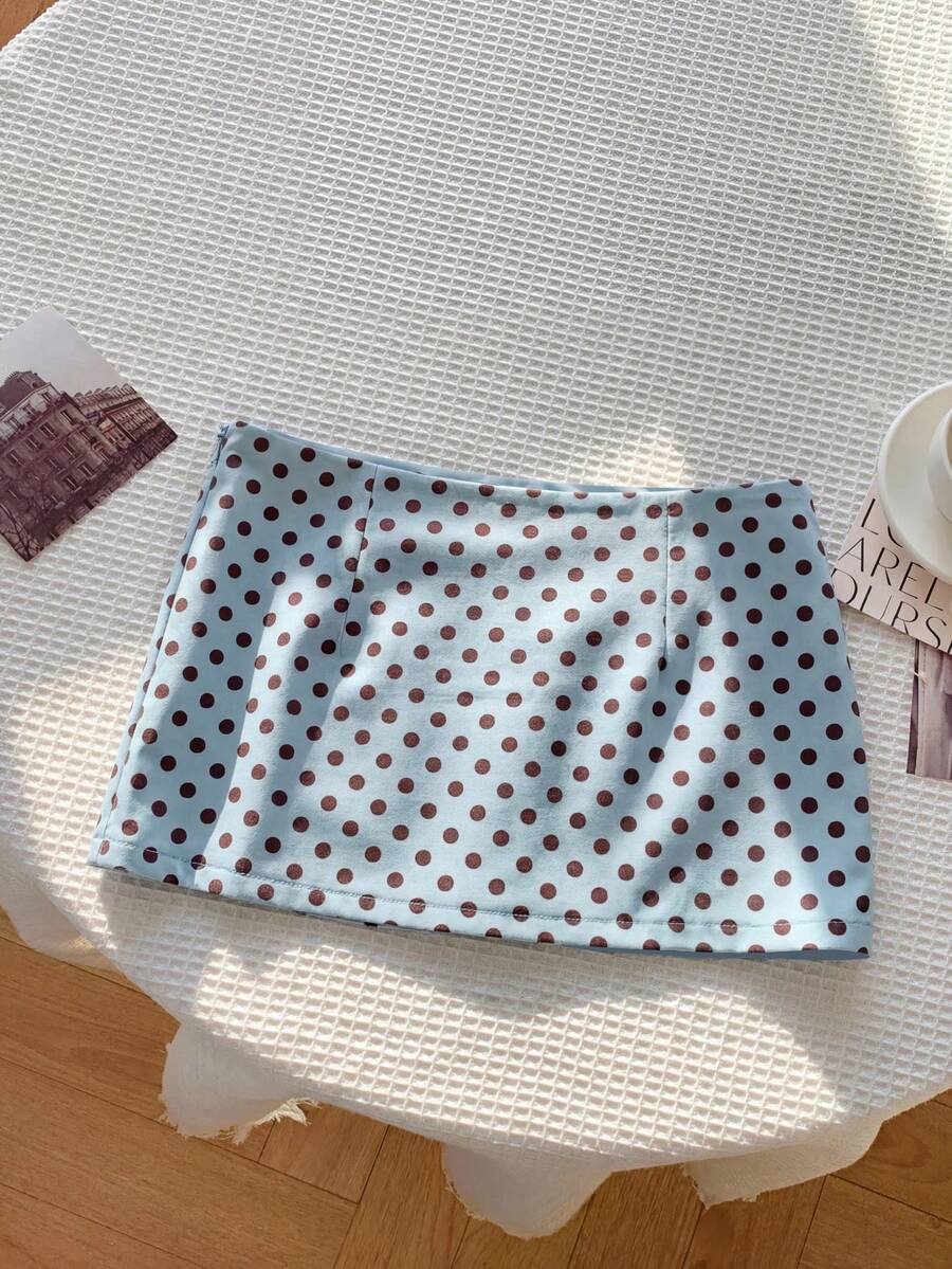 Women's white 100% cotton low waist mini skirt featuring a tropical print and zipper detail.