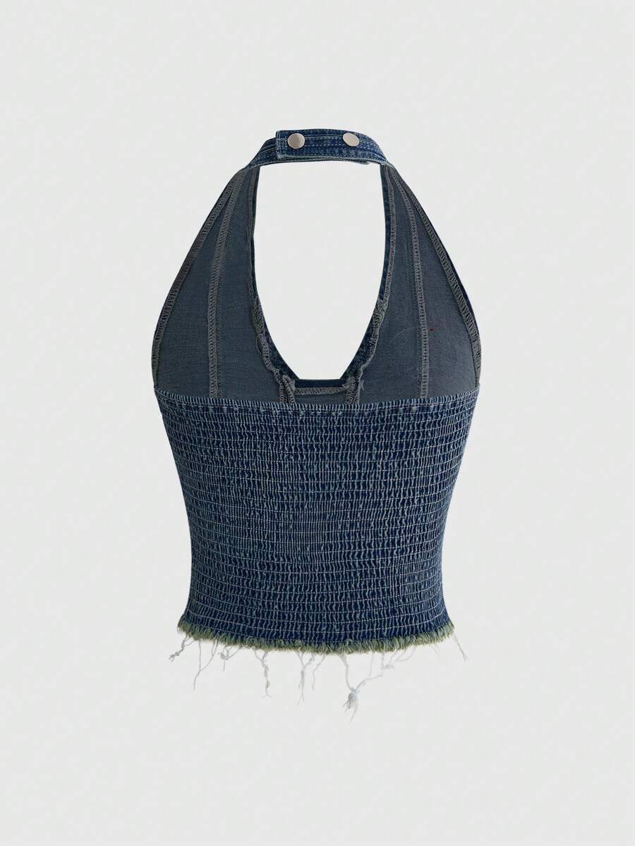A black Y2K denim halter crop top featuring a backless lace-up grommet eyelet design with a slim fit micro crop length.