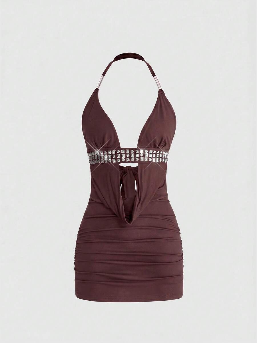 Sleeveless halter backless mini bodycon dress with high waist and tie-back detailing.