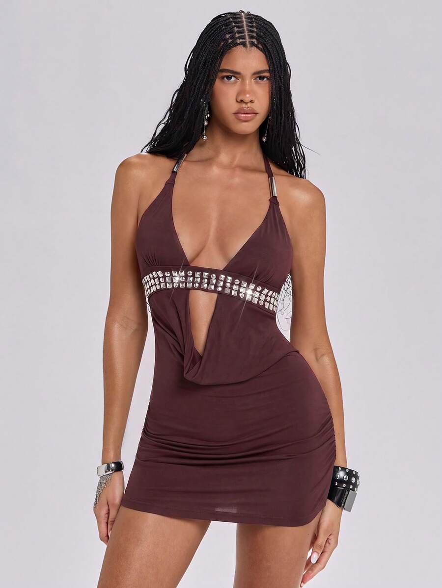 Sleeveless halter backless mini bodycon dress with high waist and tie-back detailing.