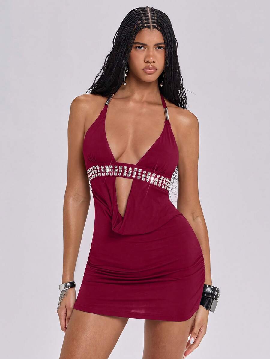 Sleeveless halter backless mini bodycon dress with high waist and tie-back detailing.