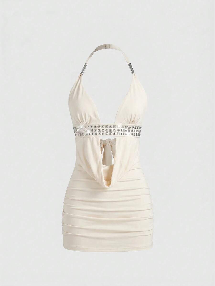Sleeveless halter backless mini bodycon dress with high waist and tie-back detailing.
