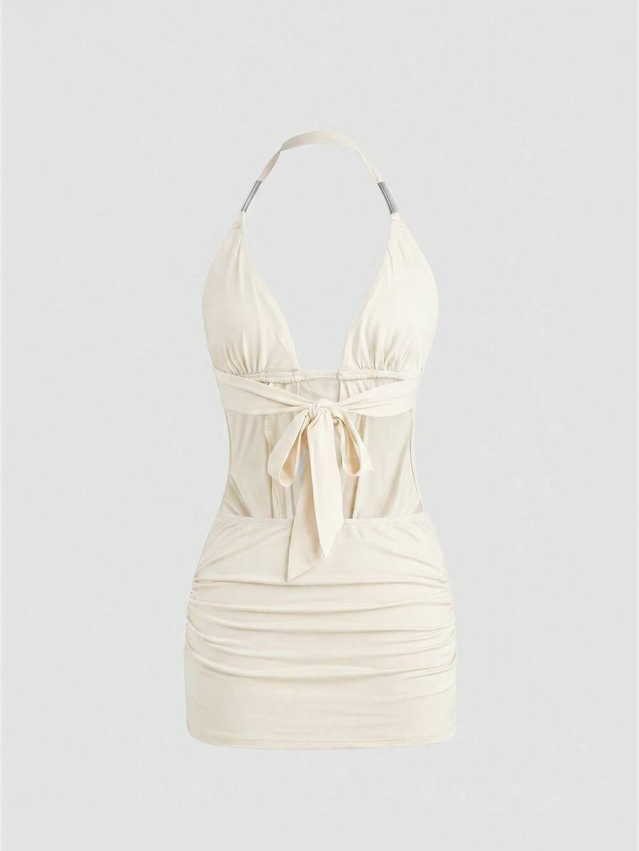 Sleeveless halter backless mini bodycon dress with high waist and tie-back detailing.
