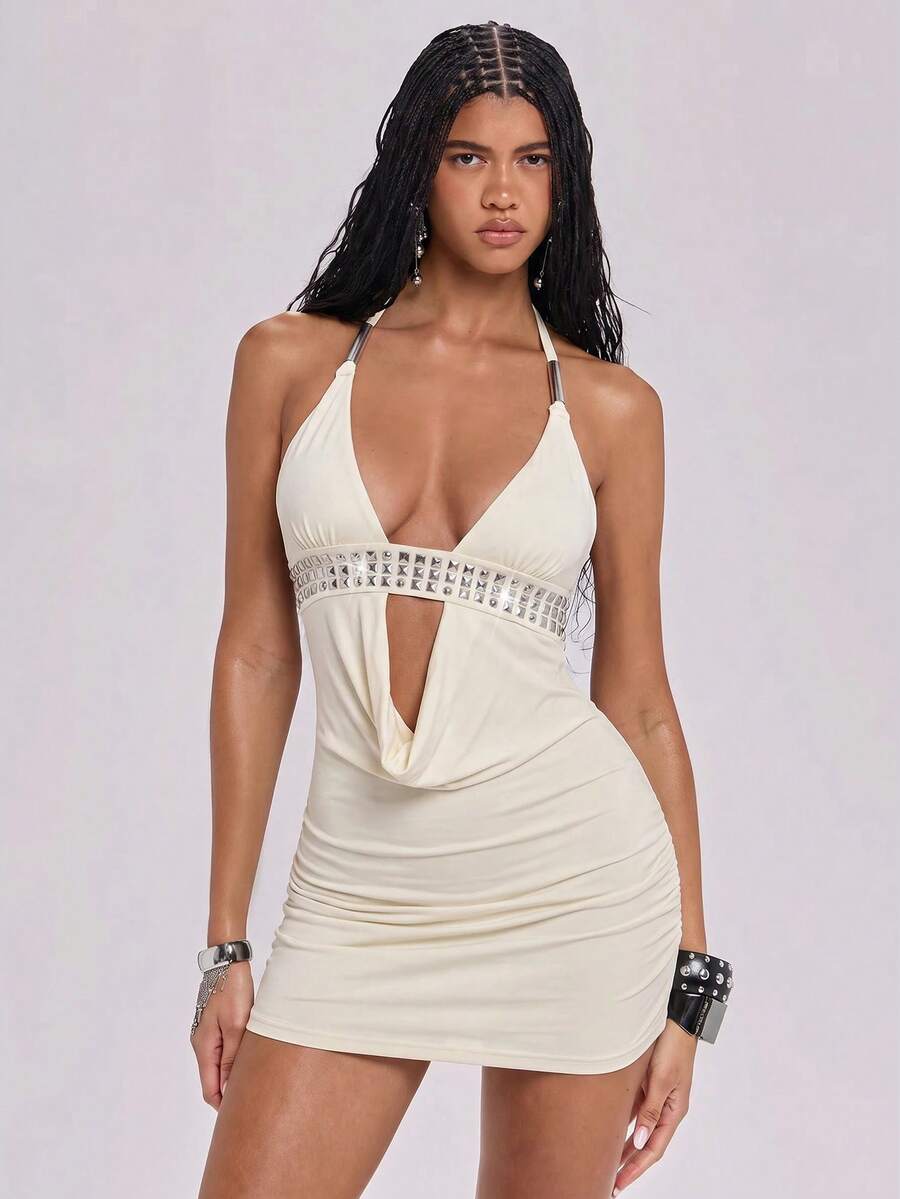 Sleeveless halter backless mini bodycon dress with high waist and tie-back detailing.