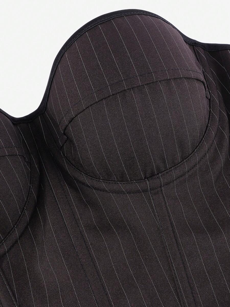 Black overbust corset top with strapless design, boned support, tie-back and zipper closure for women shapewear styling.