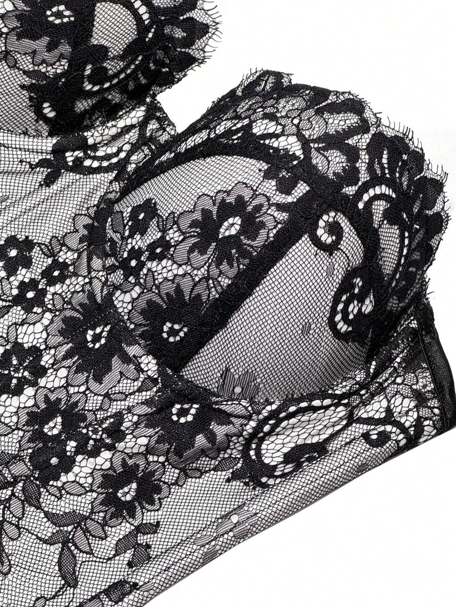 Black women's shaping cami with contrast lace, spaghetti straps, asymmetrical hem, lined body, and slim fit for casual and night-out styling.