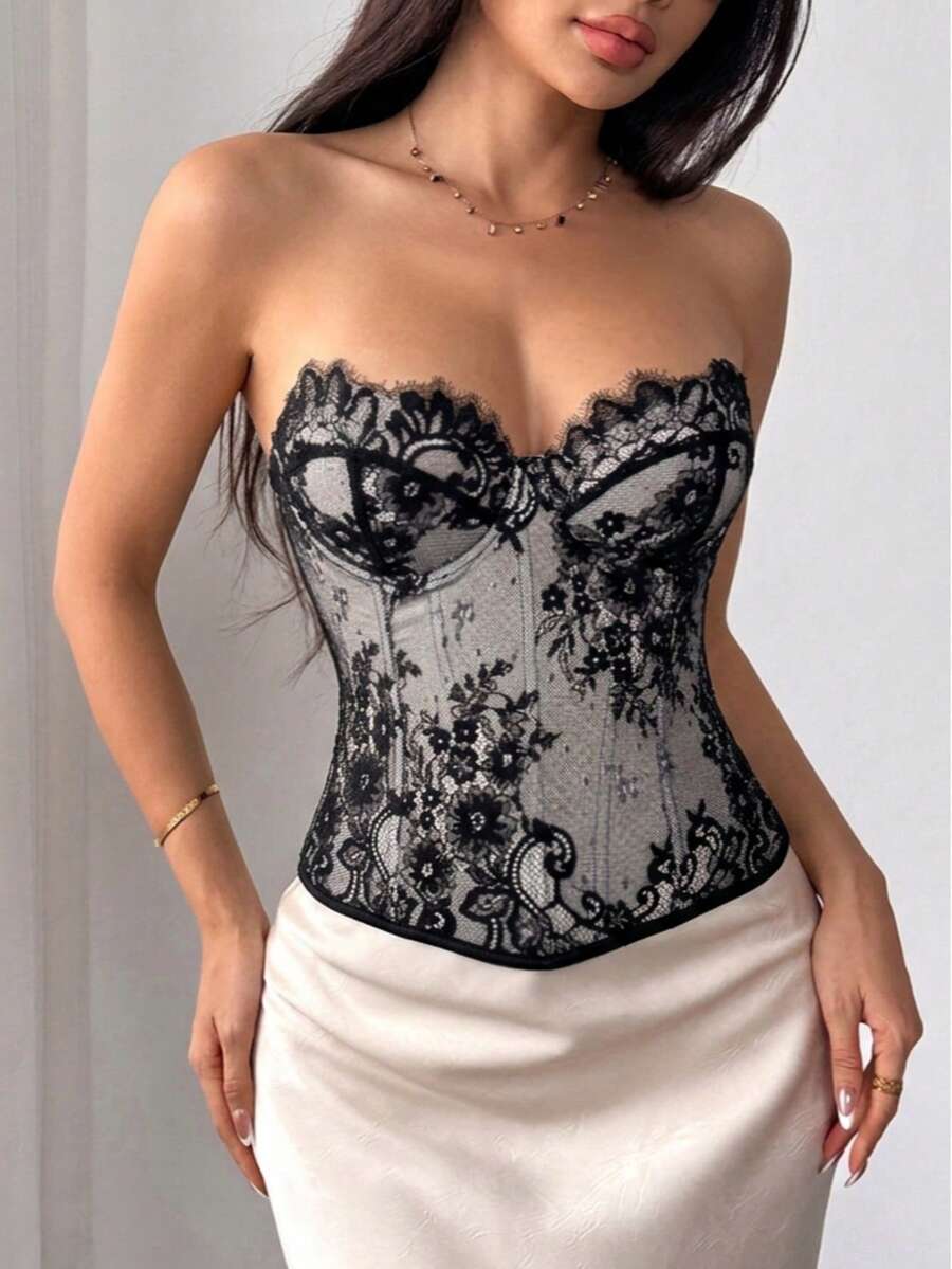Black women's shaping cami with contrast lace, spaghetti straps, asymmetrical hem, lined body, and slim fit for casual and night-out styling.