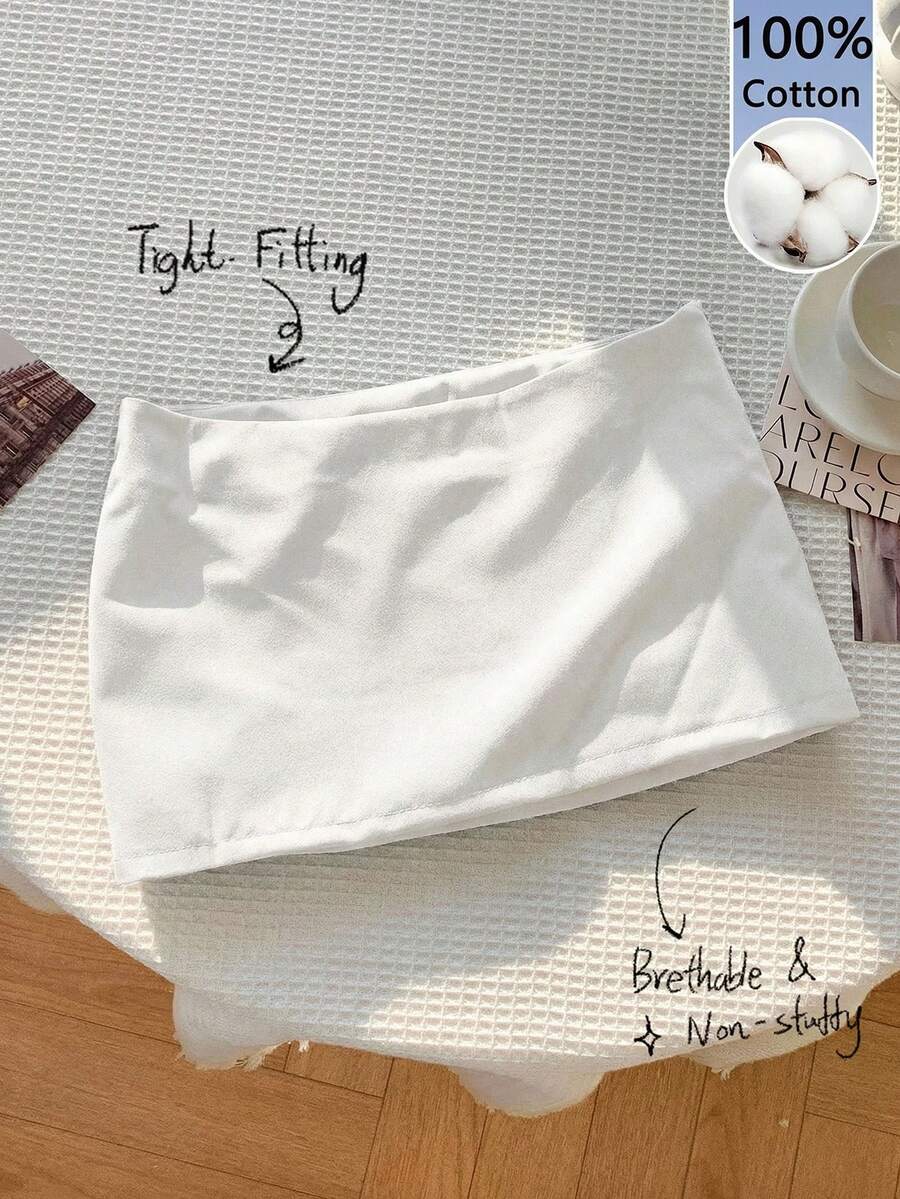 Women's white 100% cotton low waist mini skirt featuring a tropical print and zipper detail.