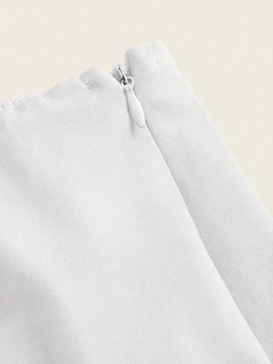 Women's white 100% cotton low waist mini skirt featuring a tropical print and zipper detail.