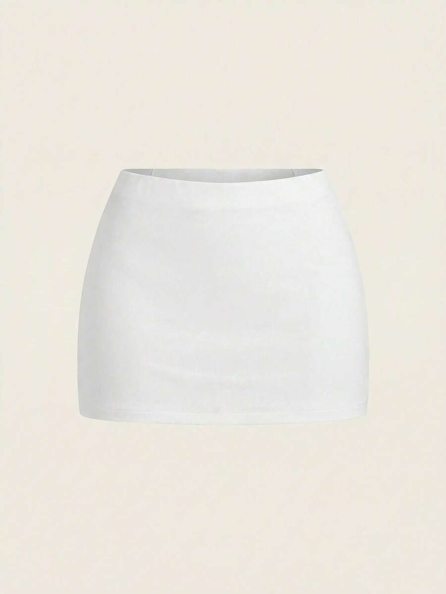 Women's white 100% cotton low waist mini skirt featuring a tropical print and zipper detail.