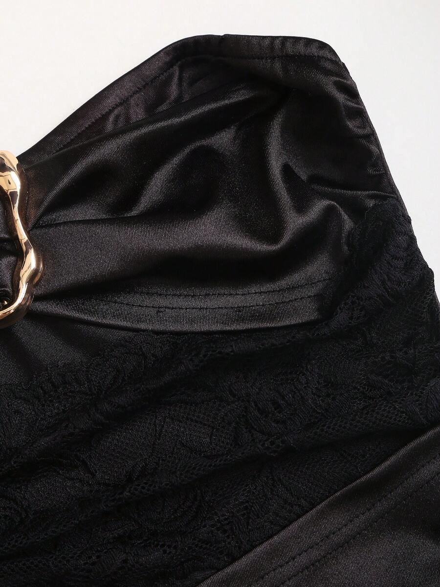 Women's black strapless bodycon mini dress featuring ruched detailing, cut-out design with ring accent, mid-waist pencil hem, and slim fit knitted stretch fabric.