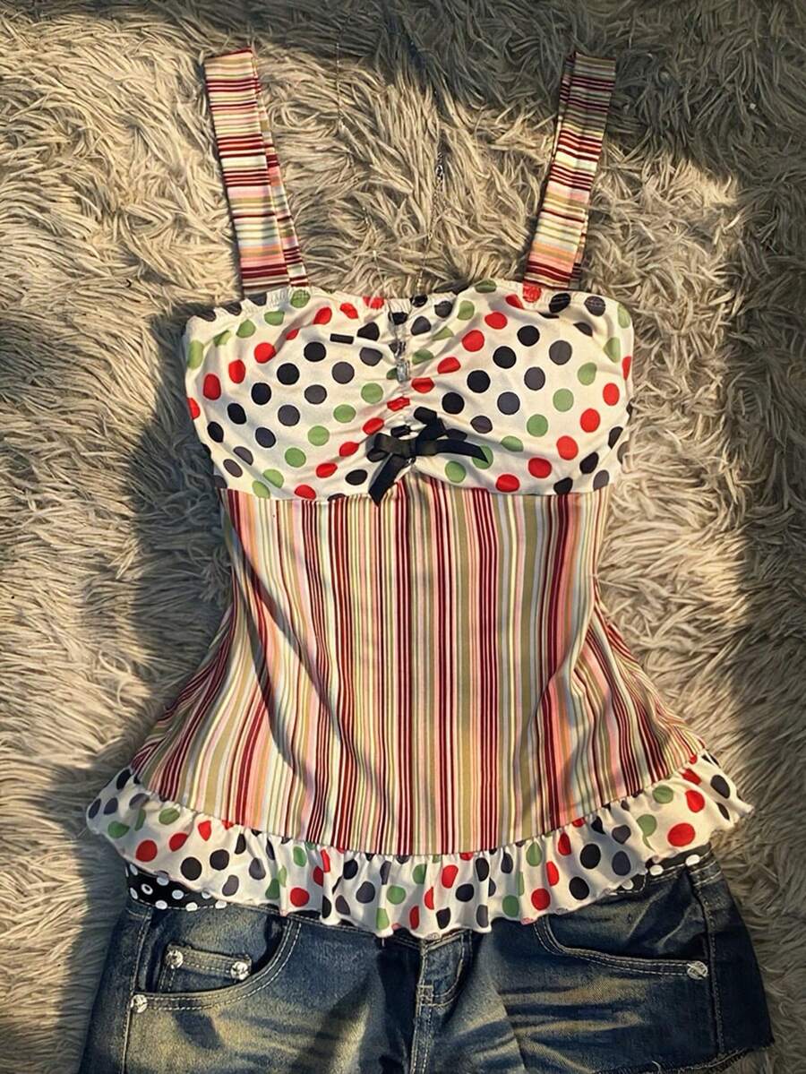 Multicolor women's wide strap tank top featuring polka dot pattern, ruched shirred bodice, and flared ruffle hem.