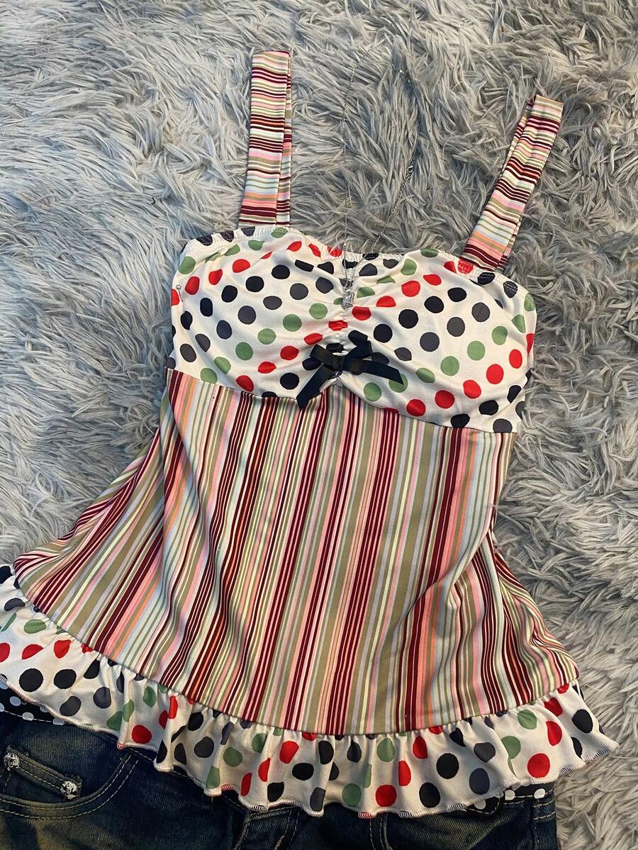 Multicolor women's wide strap tank top featuring polka dot pattern, ruched shirred bodice, and flared ruffle hem.