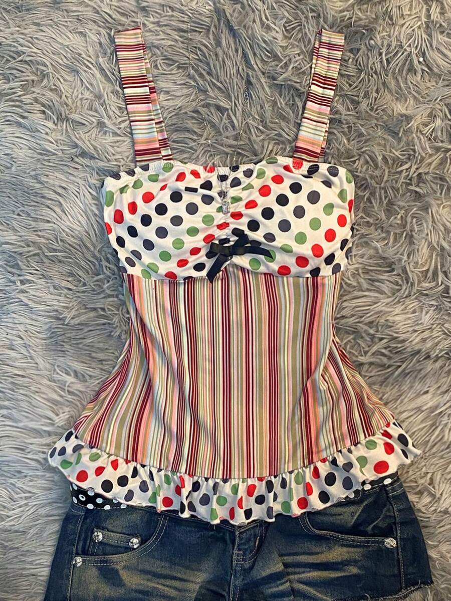 Multicolor women's wide strap tank top featuring polka dot pattern, ruched shirred bodice, and flared ruffle hem.