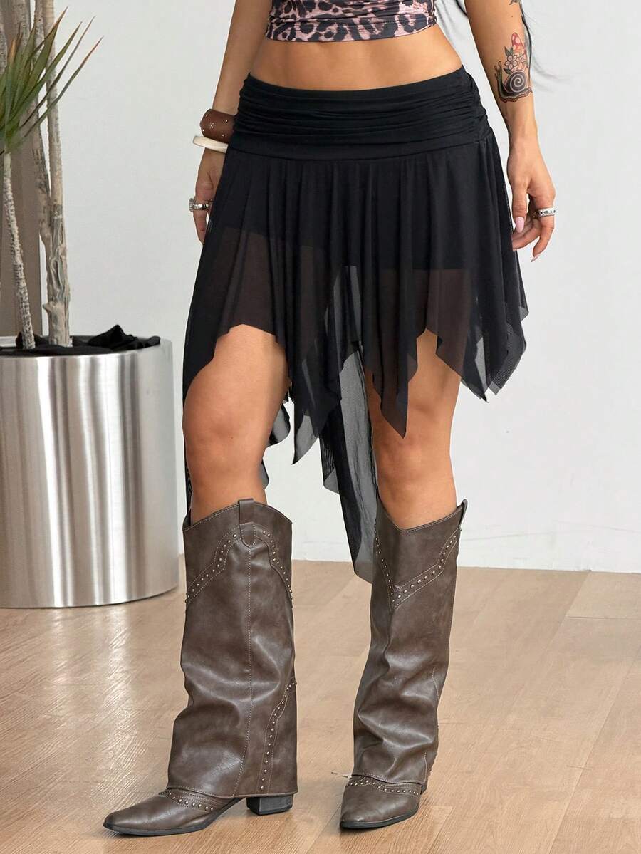 Women's asymmetrical ruffle skort with low waist, hollow out details, and lined body in knitted stretch fabric for beach and summer wear.