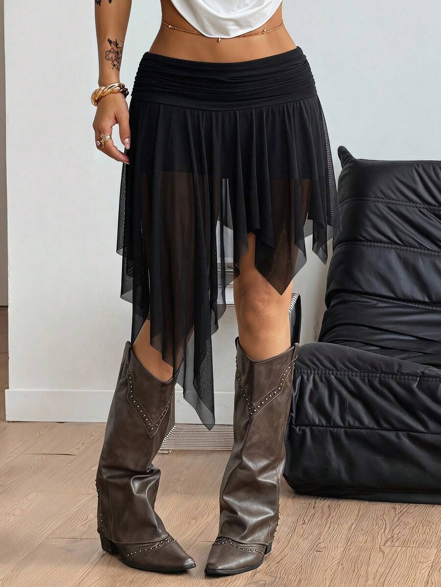 Women's asymmetrical ruffle skort with low waist, hollow out details, and lined body in knitted stretch fabric for beach and summer wear.