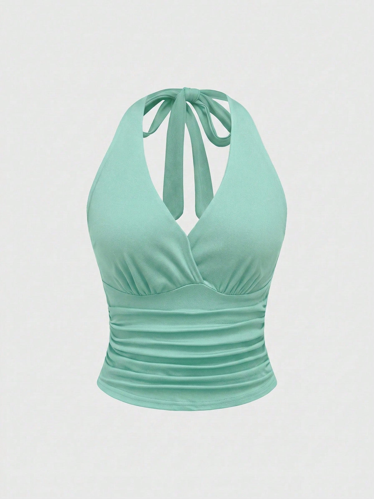 Women's halter crop tank top featuring a backless silhouette and ruched detailing in a slim fit design.