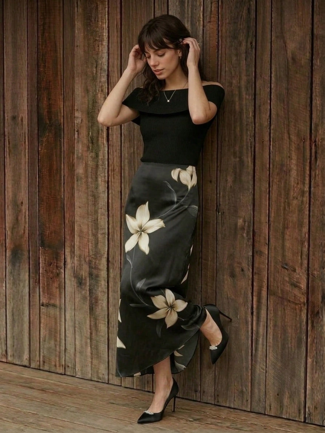 Black high-waisted floral print long mermaid skirt for women by featuring an elegant plant pattern.