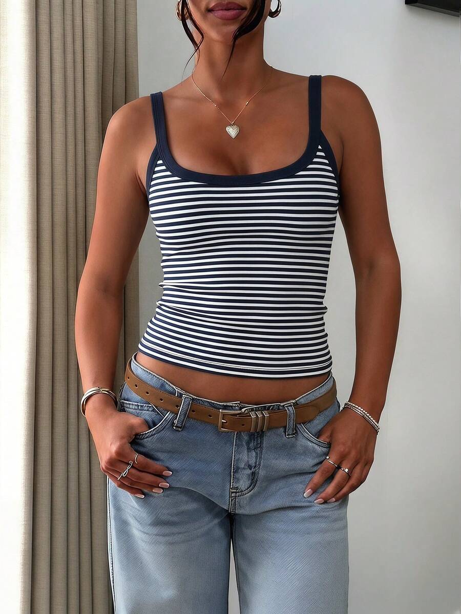 A slim fit women's crop cami tank top with spaghetti straps and a solid color design, made from comfortable stretch knitted fabric.