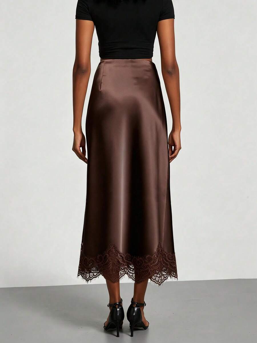 Women's brown silky satin long straight skirt featuring elegant contrast lace trim.