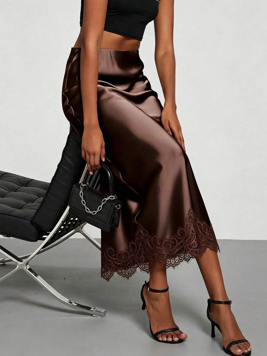 Women's brown silky satin long straight skirt featuring elegant contrast lace trim.