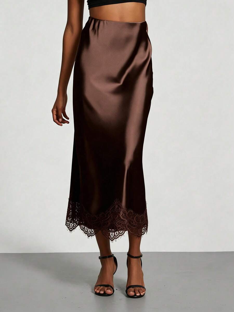 Women's brown silky satin long straight skirt featuring elegant contrast lace trim.