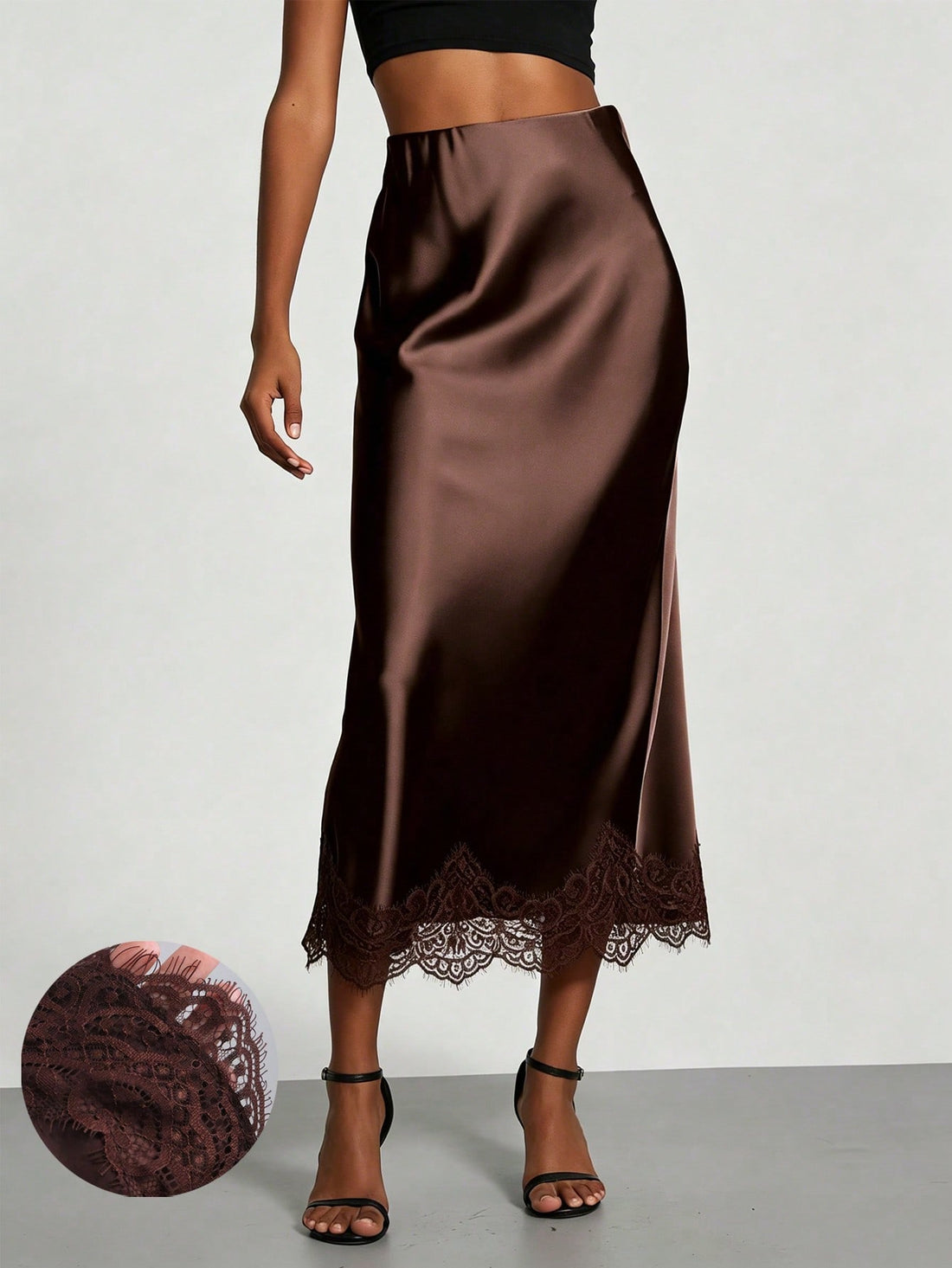 Women's brown silky satin long straight skirt featuring elegant contrast lace trim.