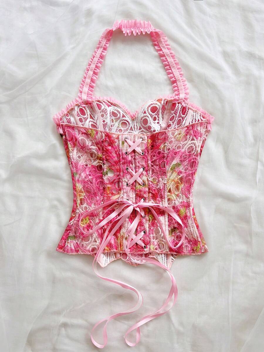 Strapless floral corset top with lace-up detail, asymmetrical hem, and slim fit for women in a boho vacation style.