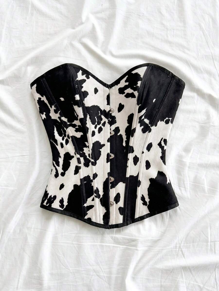 Strapless black lace-up corset top for women with grommet eyelet details, slim fit, lined body, and woven fabric construction.