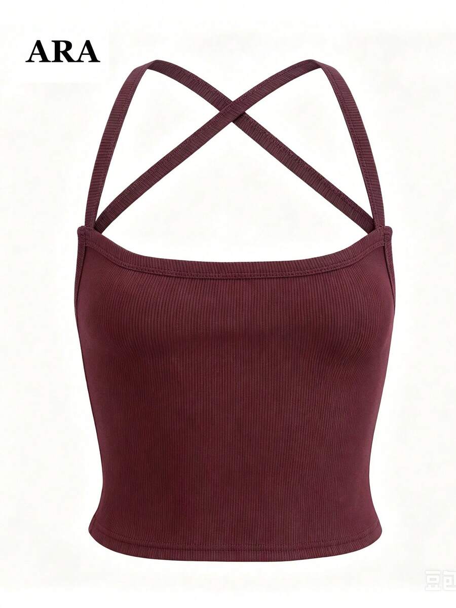 Burgundy ribbed cami tank top with criss-cross backless design and slim fit cropped silhouette.