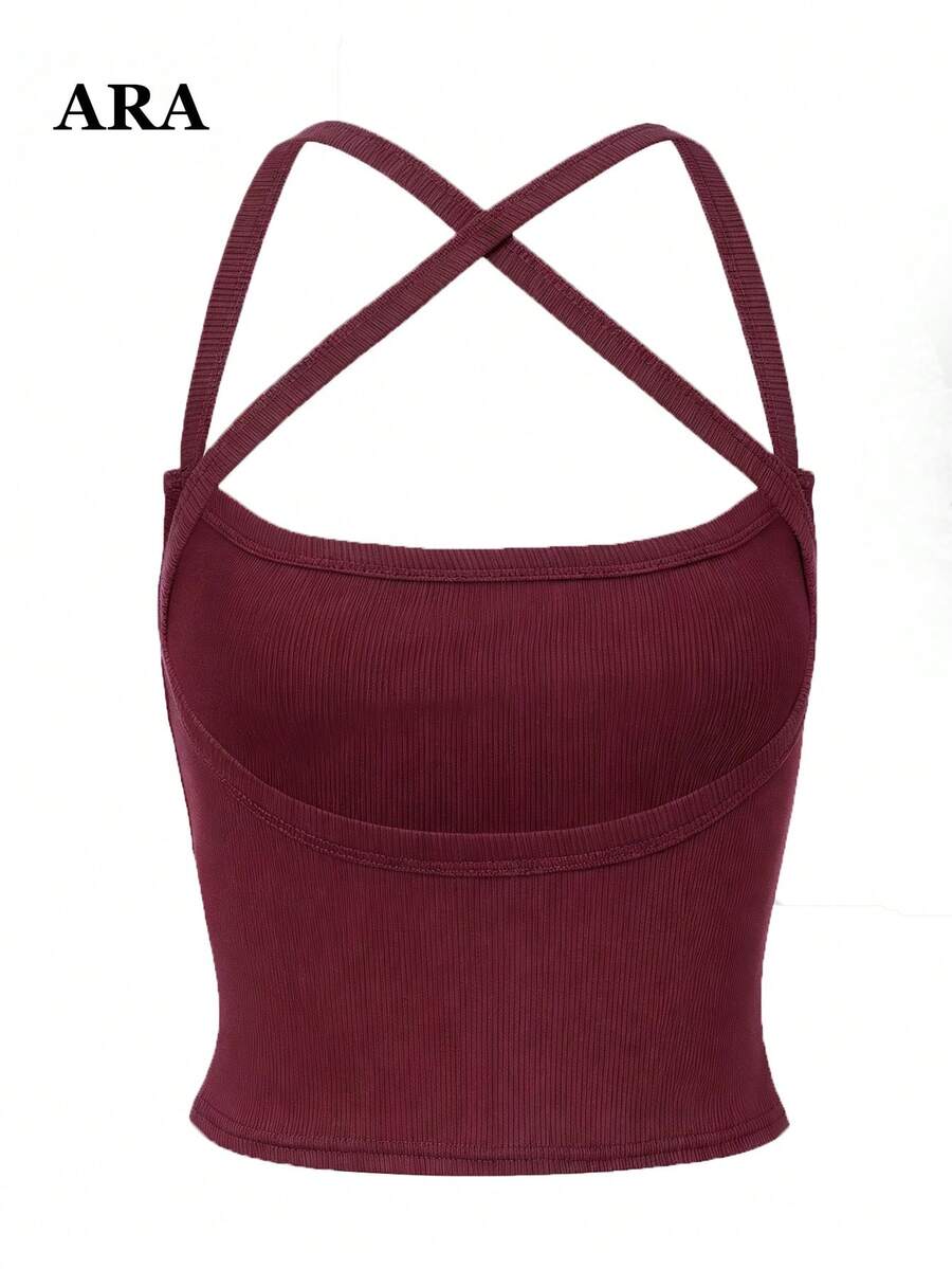Burgundy ribbed cami tank top with criss-cross backless design and slim fit cropped silhouette.