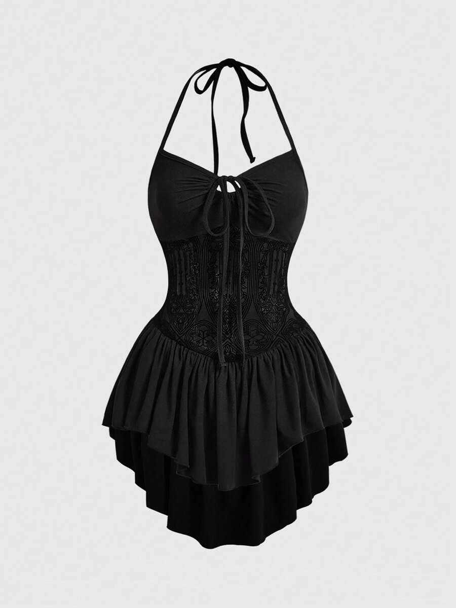 Women's black gothic mini dress featuring a halter neck, cut-out waist, contrast lace details, and an asymmetrical hem.