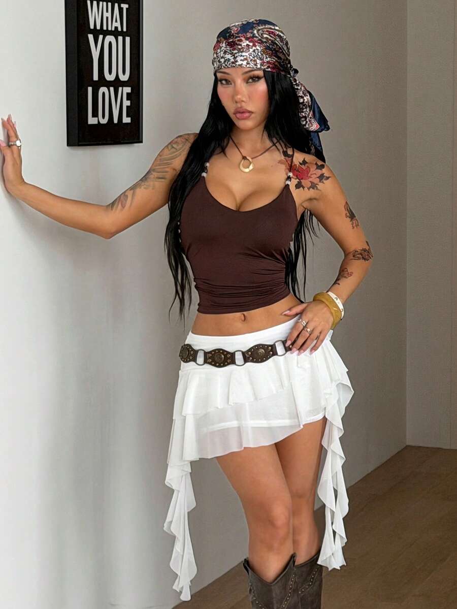Women's white low-rise mesh tiered mini skirt with pleated asymmetrical design and lined body