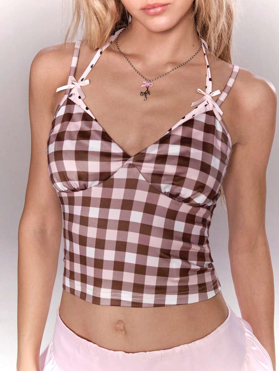 Women's multicolor plaid crop cami top featuring thin spaghetti straps, a front bow detail, and a slim fit knit design.