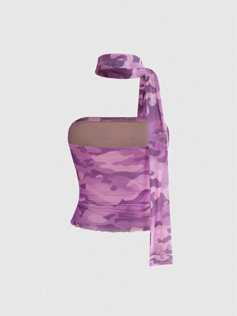 Women's black polka dot strapless tube top made of ruched mesh fabric featuring an asymmetrical hem and matching scarf.