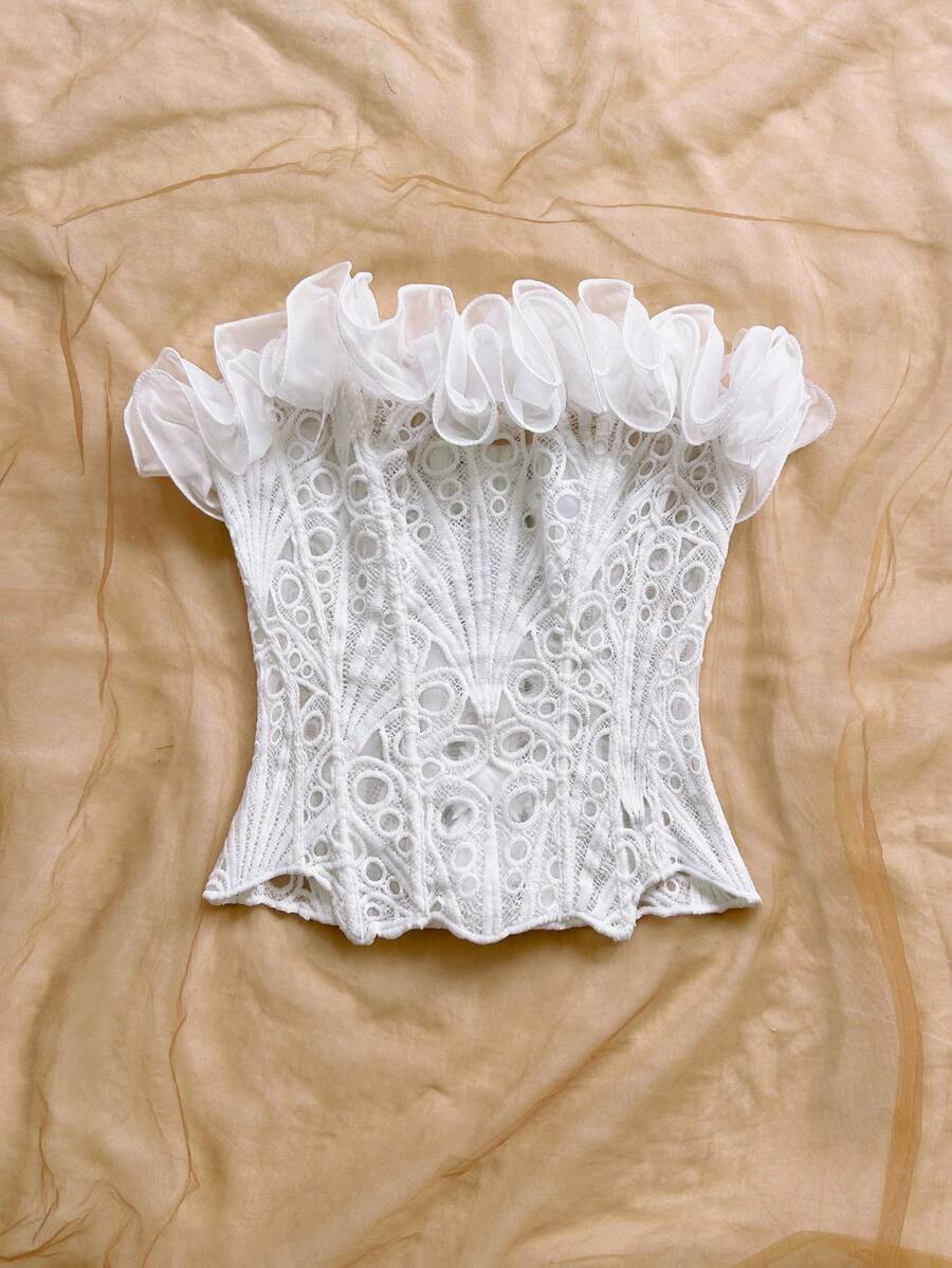Strapless floral corset top with lace-up detail, asymmetrical hem, and slim fit for women in a boho vacation style.